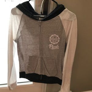 Pink hoodie that’s grey and white.